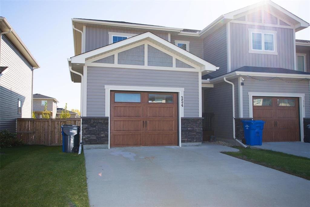 Active listing at 254 Marcoux Avenue, Lorette, MB R5K 0R5, priced at $399,999, represented by MIB Division at Royal LePage Prime